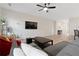 Spacious living room with plush seating, a ceiling fan, and wood-look floors at 3934 Saddle Bag Ct, Dacula, GA 30019