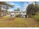 Large backyard with a deck and shed, viewed from afar at 934 Bay Ridge Dr, Lawrenceville, GA 30045