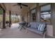 Covered back porch with seating, a table, and outdoor grill at 1680 Holcomb Lake Rd, Marietta, GA 30062