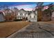 Attractive two-story home with a two-car garage and landscaped front yard at sunset at 219 Regency Ct, Acworth, GA 30102