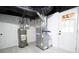 Unfinished basement with HVAC system and water heater; white door to exterior at 4001 Red Oak Dr, Atlanta, GA 30340