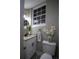 Modern bathroom with white vanity, decorative floor tile, and stylish accents at 4001 Red Oak Dr, Atlanta, GA 30340