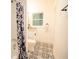 Clean and bright bathroom with updated fixtures, patterned floor tile, and a shower/tub combo at 4001 Red Oak Dr, Atlanta, GA 30340