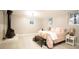 Cozy bedroom with fireplace, soft pink bedding, and ample natural light at 4001 Red Oak Dr, Atlanta, GA 30340