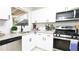 Modern kitchen featuring white shaker cabinets, stainless steel appliances, and granite countertops at 4001 Red Oak Dr, Atlanta, GA 30340