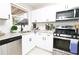 Modern kitchen featuring white shaker cabinets, stainless steel appliances, and granite countertops at 4001 Red Oak Dr, Atlanta, GA 30340