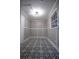 Laundry room with decorative black and white tile floor and white wainscoting at 4001 Red Oak Dr, Atlanta, GA 30340
