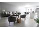 Open concept living and dining area with modern furniture, neutral colors, and light gray walls at 4001 Red Oak Dr, Atlanta, GA 30340