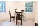 Home office or study with ample natural light, a mint green desk, and wood chairs at 4001 Red Oak Dr, Atlanta, GA 30340