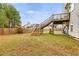 Large backyard with a deck and stairs leading to the house at 6215 Nellie Se Ct, Mableton, GA 30126