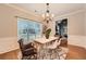 Bright dining room with hardwood floors and chandelier at 3301 Hackmatack Nw Dr, Kennesaw, GA 30152