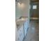 Modern bathroom with double vanity, large shower, and marble floors at 3354 Wesley Chapel Rd, Decatur, GA 30034