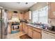 Kitchen with light wood cabinets, stainless steel appliances, and tile floor at 4027 Crossings Way, Stone Mountain, GA 30083