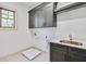 Spacious laundry room with gray cabinets, sink, and ample counter space at 4093 Longleaf Ln, Tucker, GA 30084