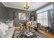 Living room with gray walls, large window, couch and coffee table at 10119 Azalea Dr, Covington, GA 30014