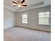 Spacious bedroom with plush carpet, tray ceiling, and ample natural light at 148 Werner Brook Sw Way, Atlanta, GA 30354