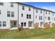 Townhome exteriors with white siding, fenced yards, and private patios at 148 Werner Brook Sw Way, Atlanta, GA 30354