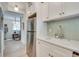 Modern kitchen with stainless steel appliances, white cabinetry, and a view to the dining area at 589 Auburn Ne Ave # H, Atlanta, GA 30312