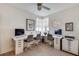 Modern home office with a spacious corner desk, white furniture, and contemporary artwork at 589 Auburn Ne Ave # H, Atlanta, GA 30312