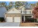 Two-story house with gray siding, brick accents, and a two-car garage at 4274 Linworth Blvd, Austell, GA 30106