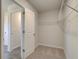 Walk-in closet with wire shelving and convenient access to the main bathroom at 224 Chiswick Loop, Stockbridge, GA 30281