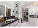 Elegant bathroom with dark granite countertops and white cabinets at 370 Park Ne Pl, Atlanta, GA 30317