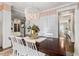 Bright dining room with white chairs and a large table at 370 Park Ne Pl, Atlanta, GA 30317