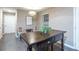 Bright dining area with hardwood floors and two decorative chairs at 4948 Emmett Still Rd, Loganville, GA 30052