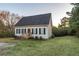 Charming one-story house with black shutters, wooden steps, and a grassy lawn at 4948 Emmett Still Rd, Loganville, GA 30052