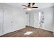 Bedroom with brown carpet, white walls, and an ensuite bathroom at 7017 Ray St, Riverdale, GA 30274