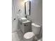 Stylish bathroom with a modern vanity, black accents, and marble-look tile at 1580 Hampshire Pl, Decatur, GA 30032