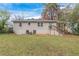 House exterior view, showing a spacious backyard with green lawn at 2479 Brentwood Rd, Decatur, GA 30032