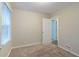 Spacious bedroom with carpet flooring and neutral wall colors at 2479 Brentwood Rd, Decatur, GA 30032