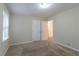 Bright bedroom with carpet, double closet, and access to the bathroom at 2479 Brentwood Rd, Decatur, GA 30032