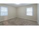 Well-lit bedroom featuring neutral walls and carpet at 2479 Brentwood Rd, Decatur, GA 30032