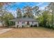 Ranch style home with carport and landscaped lawn at 2479 Brentwood Rd, Decatur, GA 30032