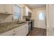Modern kitchen with granite counters and stainless steel appliances at 2479 Brentwood Rd, Decatur, GA 30032