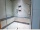 Spacious shower with multiple shower heads and built-in seat at 2267 Valla Parc Ct, Marietta, GA 30062