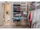 Walk-in closet with built-in shelving and ironing board at 2267 Valla Parc Ct, Marietta, GA 30062