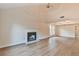 Spacious living room highlighting fireplace, wood floors, ceiling fan, and plenty of natural light at 4021 E Meadow Dr, Duluth, GA 30096