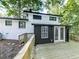 Backyard deck with stairs to the main level and trees surrounding the home at 1564 Bubbling Creek Rd, Brookhaven, GA 30319