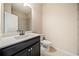 Bathroom with dark wood vanity, white countertop, and tiled floor at 6404 Brookside Se Blvd, Mableton, GA 30126