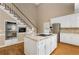 Kitchen island with cooktop, stainless steel appliances, and double ovens at 1501 Annapolis Way, Grayson, GA 30017