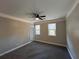 Spacious bedroom with gray carpet, ceiling fan, and natural light at 941 Capitol View Ave, Atlanta, GA 30318