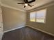 Bedroom with gray carpet, ceiling fan, and large window at 941 Capitol View Ave, Atlanta, GA 30318