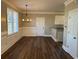 Dining area with chandelier, wainscoting, and access to a partial view of the kitchen at 941 Capitol View Ave, Atlanta, GA 30318