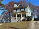 Front exterior view of a blue two-story home with driveway and landscaping at 941 Capitol View Ave, Atlanta, GA 30318