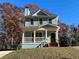 Charming blue two-story home with a front porch and grassy yard at 941 Capitol View Ave, Atlanta, GA 30318