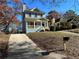 Exterior view of a light blue house with driveway leading to the front entrance at 941 Capitol View Ave, Atlanta, GA 30318