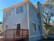 Light blue two-story home with a wooden deck, viewed from the side at 941 Capitol View Ave, Atlanta, GA 30318